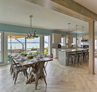 Modern Waterfront Home with Patio Fire Pit  Dock